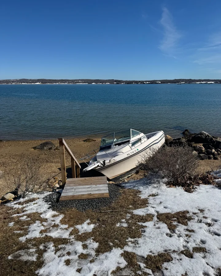 Boat removal crew loading vessel onto trailer